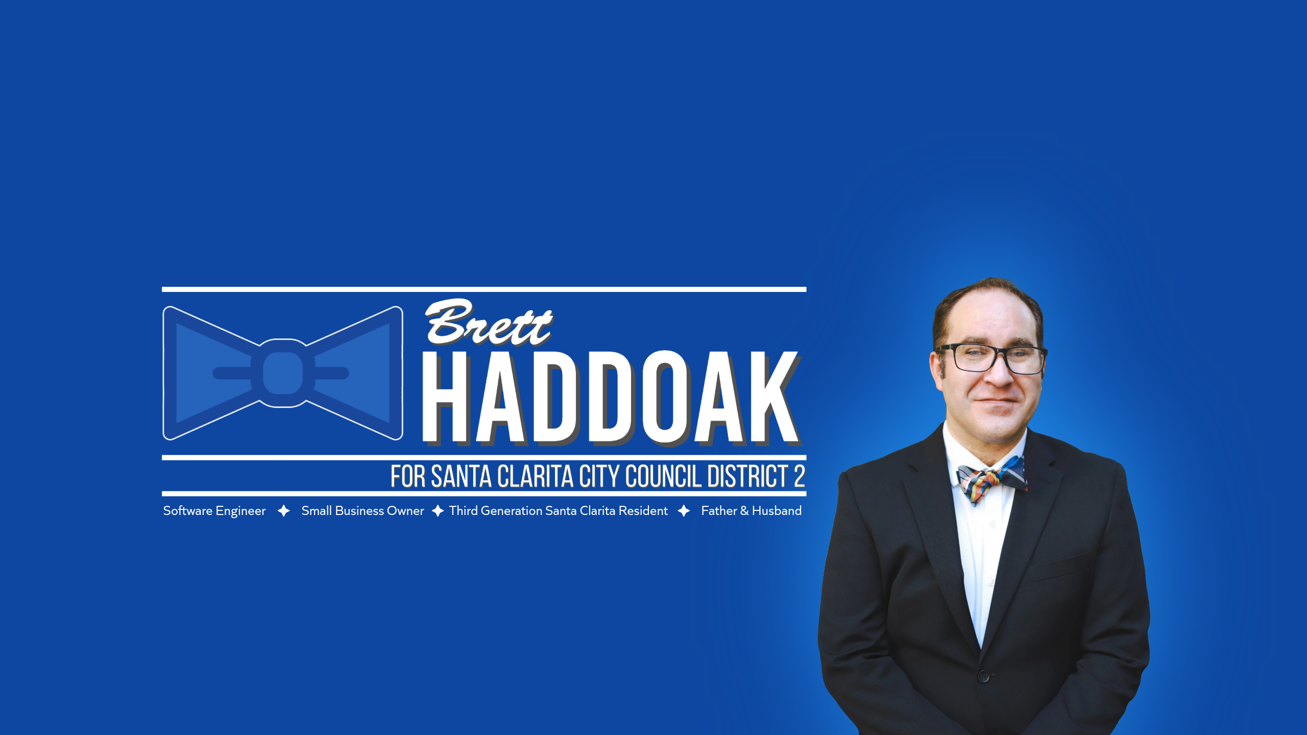 Blue campaign graphic reading Brett Haddoak for Santa Clarita City Council District 2, with the bow tie mark and a photo of Brett.